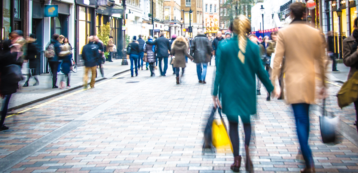 Shoppers walking down a UK high street